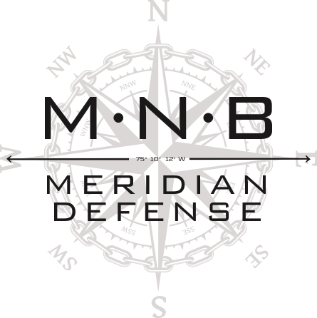a navigation compass rose encircled by a sailing rudder chain locking the compass points at true north, with the 1776 United States Prime Meridian superimposed on the compass along with the name of the Company MNB Meridian Defense